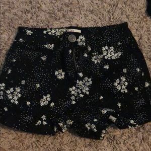 Black shorts with daisy print